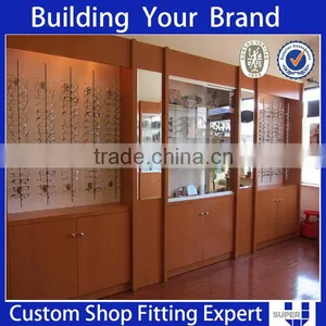 Simple Style White Wall Mouted Sunglasses Optical Store Design thumbnail-3