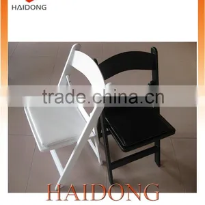 Space Saving White and Black Resin Folding Chair thumbnail-1