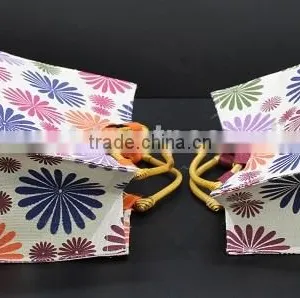 PP Laminated Jute Tote Bag With Wooden Eye Shape Cane Handle - Exclusive Printed Design thumbnail-4