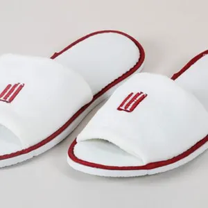 Wholesale White Eva Disposable Hotel Slipper With Embroidered Logo thumbnail-1