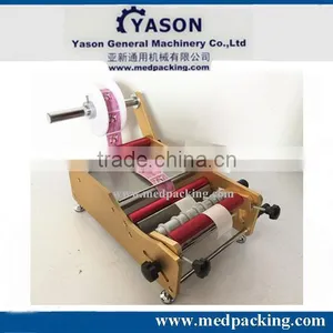 Manual Round Bottle Sticker Label Machine Labels on Round Bottle/round Jar/cylinder thumbnail-1