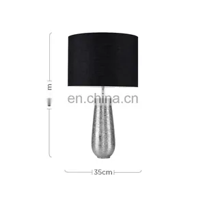 Korea Custom Cheap Ceramic Base Unique Fancy Carved Surface Silver Cylinder Bedside Lamp With Logo thumbnail-2