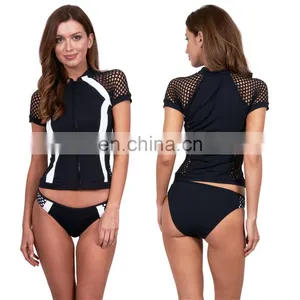 Rash Guard Manufacturer Custom Black and White Short Sleeve Zip up Panelling Mesh Surf Lycra Rash Guard for Ladies thumbnail-1