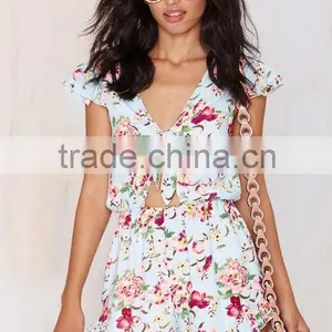 Light Blue Colorful Floral Print Romper Tie Closure At Neck Above Cutout & Ruffled Detailing At Hem And Sleeves thumbnail-2