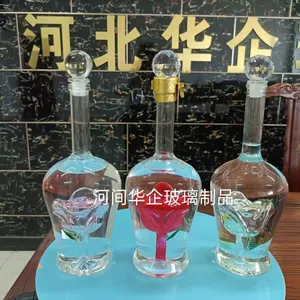China Factory Direct Hand Blown Glass Liquor Bottle With Rose Inside, 500ml Custom Logo Empty Spirit Bottle for Whiskey & Luxury Packaging thumbnail-1