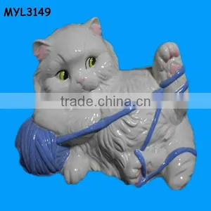 Ceramic Fat Cat Statue Playing With a Blue Yarn Ball thumbnail-1