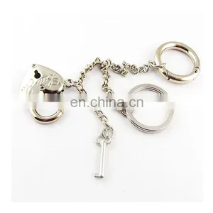 Polished Nickel Key Shape Keychain thumbnail-1