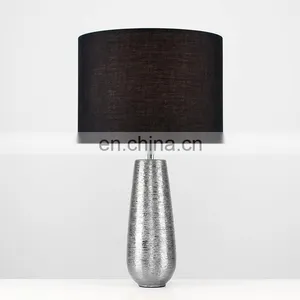 Korea Custom Cheap Ceramic Base Unique Fancy Carved Surface Silver Cylinder Bedside Lamp With Logo thumbnail-3