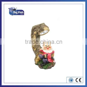 Solar Powered Polyresin Garden Gnome on Tree Stump Spot LED Solar Garden Light thumbnail-1