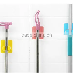 Wholesale Stock Magic Wall Suction Plastic Mop Handle Storage Holder thumbnail-3