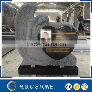 Hand Carved Angel Holding Granite Heart Tombstone thumbnail-1