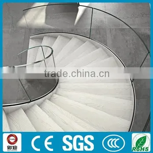 Stainless Beam and Wood Tread Helical Stair thumbnail-2