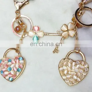 A Heart-shaped Key And A Rhinestone Heart Key Chain thumbnail-1