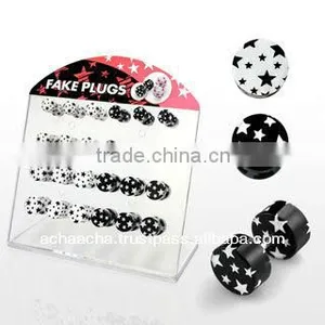 Display With 24 Pcs. of Acrylic Illusion Fake Plugs With Black and White Multi Star Design - Size 6mm - 8mm thumbnail-1