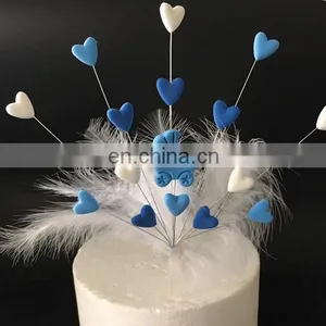 Unique Design Baby Birthday Party Decoration Clay Baby Carriage Heart Shaped With Feather Cake Topper thumbnail-1