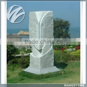 Abstract Outdoor Stone Human Faces Sculpture thumbnail-1