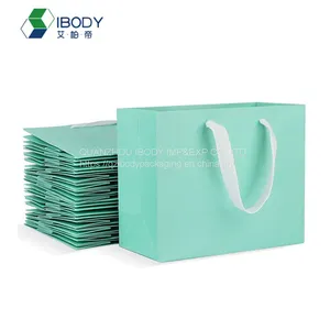 Customized Luxury Golden Hot Stamping Shopping Bag With Ribbon Handle White Cardboard Paper Bag thumbnail-1