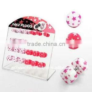 Display With 24 Pcs. of Acrylic Illusion Fake Plugs With Pink and White Multi Star Design - Size 6mm - 8mm thumbnail-1
