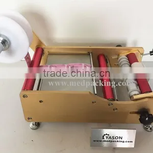 Manual Round Bottle Sticker Label Machine Labels on Round Bottle/round Jar/cylinder thumbnail-2
