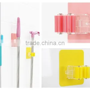 Wholesale Stock Magic Wall Suction Plastic Mop Handle Storage Holder thumbnail-4