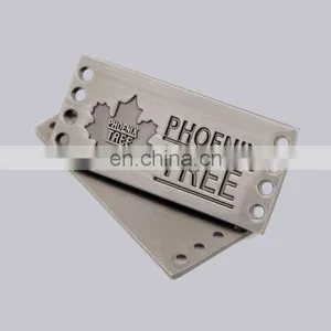 Professional Garment Decoration Use Custom Nikcel Plated Engraved Logo Type Jeans Metal Label With Holes thumbnail-1