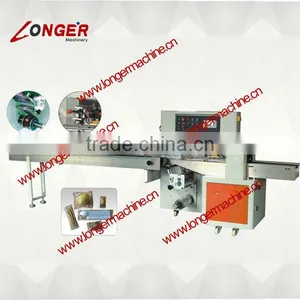 2014 New Down-paper Pillow Packing Machine|Peanut Brittle Making Machine thumbnail-1