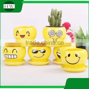 Wholesale Cheap Mini Yellow Round Cup Shape Handwork Decoration Smiling Face Cement Garden Flower Pot thumbnail-1