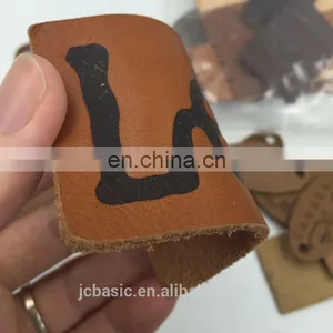 Customized Bulk Debossed Logo Genuine Leather Labels for Bags thumbnail-1