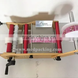 Manual Round Bottle Sticker Label Machine Labels on Round Bottle/round Jar/cylinder thumbnail-6