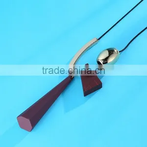 Geometric Wood Bead Pendant Necklace Gold Curved Tube Bead Black Chain Necklace Geomotric Rubber Pendant Long Sweater Necklace thumbnail-6