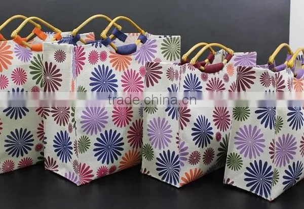 PP Laminated Jute Tote Bag With Wooden Eye Shape Cane Handle - Exclusive Printed Design photo-2