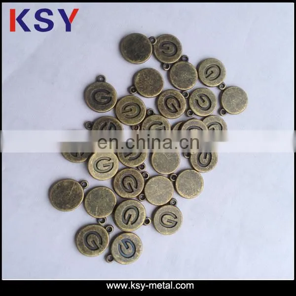 Engraved small bulk metal charm