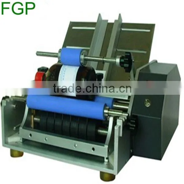 Semi automatic type round bottle cold wet glue manual labeler paste labeling machine