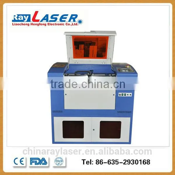 China mini co2 MDF Wood Acrylic Granite Stone Paper Fabric Laser Cutting Machine Price