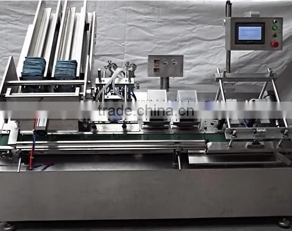 China Guangzhou GMP Standard Double Head Face Mask Making Machine photo-2