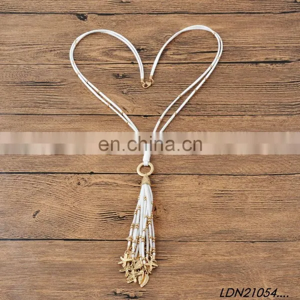 Bohemian White Suede Tassel Pendant Necklace Jewelry With Gold Starfish and Leaves Pendant on Tassel photo-4