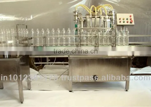 FULLY AUTOMATIC LIQUID BOTTLE FILLING MACHINE