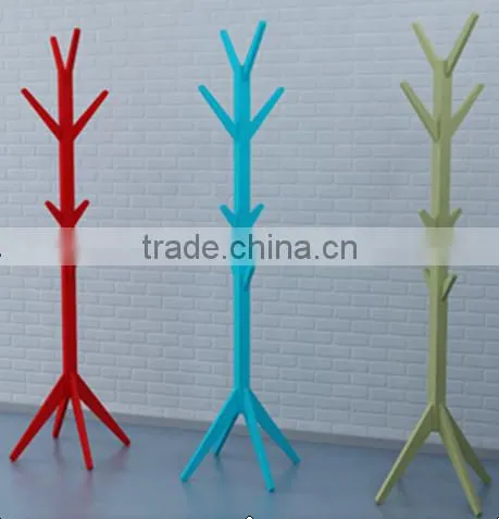 Colorful hanging clothes rack in house