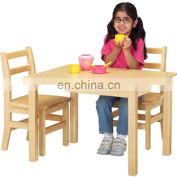 School and kindergarten kids study wooden table and chairs set