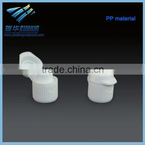 Small white plastic toothpaste flip top caps