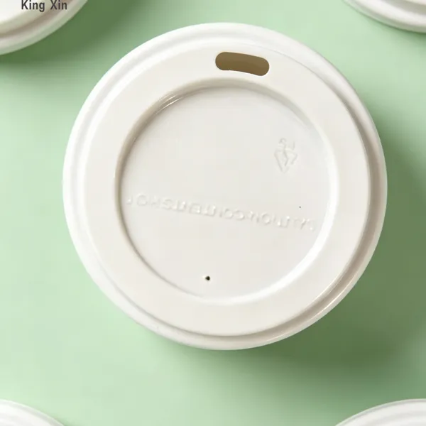 A disposable plastic beverage cap that is spill-proof and leak-proof