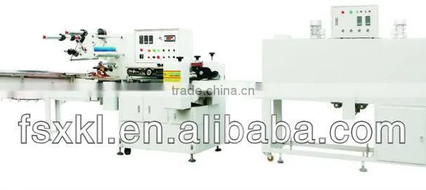 Automatic shrink packaging machine