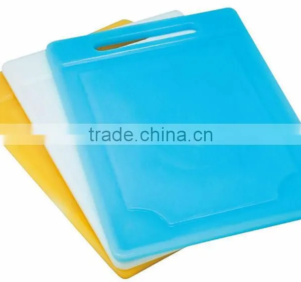 Plastic cutting board with weight