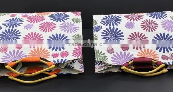 PP Laminated Jute Tote Bag With Wooden Eye Shape Cane Handle - Exclusive Printed Design photo-3