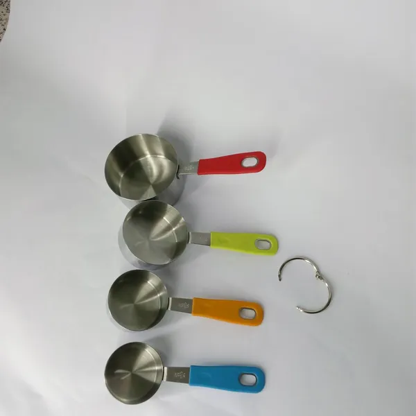 This is a Measuring Spoon Set With Plastic Handles and Connected by a Metal Ring for Convenience. With an Egg Separator Included, the Set is Handy for Any Mum or Aspiring Cook. This Measuring Spoon Set is a Must for Any Kitchen photo-2