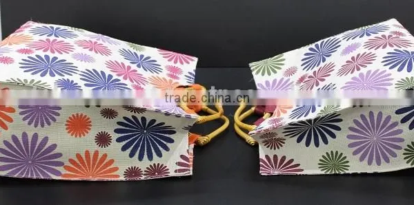 PP Laminated Jute Tote Bag With Wooden Eye Shape Cane Handle - Exclusive Printed Design photo-4