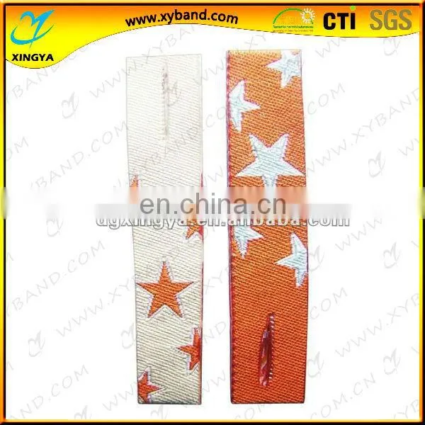 Laser pore woven zipper head puller with star