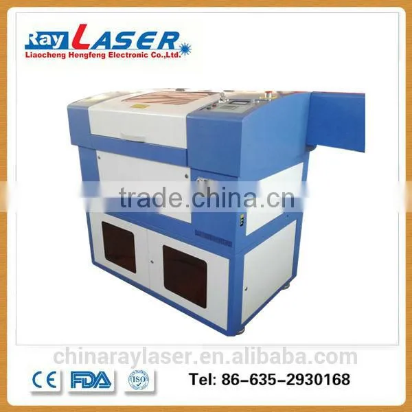 China CO2 SmallAcrylic Granite Stone Paper Fabric Laser Cutting Machine Price Cheap photo-2