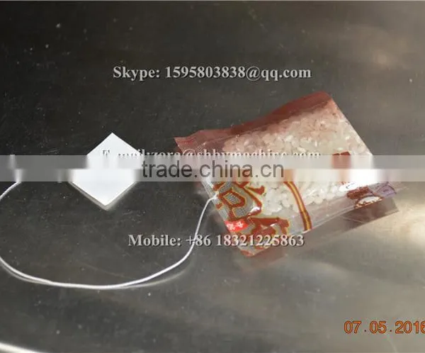 Automatic Small Tea Pouch Packaging Machine With Inner Outer Bag Thread and Tag photo-4