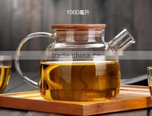 Made in China Glass Teapot Kettle With Measurement Scale Wooden Lid Handmade photo-2
